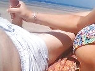 a slut jerks me off on the beach, her hands are full of cum
