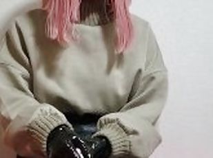 kigurumi plays with her PVC gloves.