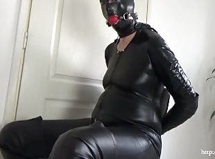 Cuffed Catwoman with cum on latex mask and in mouth