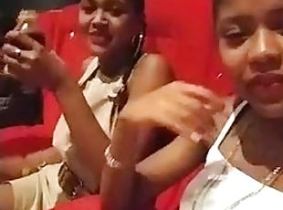 Two Latina girls at cinema