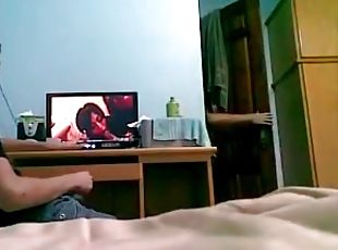 Twink masturbates to porn in voyeur video
