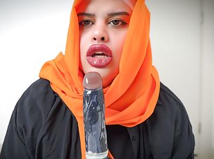Arab deepthroats a dildo and her ass is open.