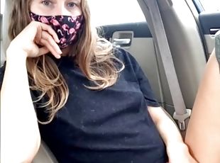 Masked girl plays with her pussy in the car